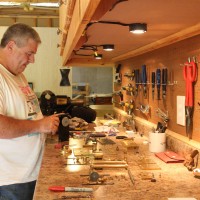 Al Hall disassembles the flyball governor in his workshop