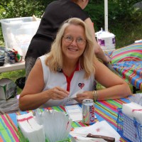 Sue Hubbard at the registration desk, July 2007 Cookout