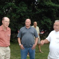 Dr. Robert Wilson speaking with member Ray Kennison and Trustee Jack Szelka