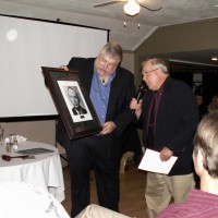 Glenn Jackson presents Dave Huestis with a plaque at Skyscrapers 75th Anniversary Banquet