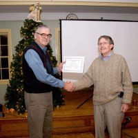 Dave Hurdis presents Gerry Dyck with a certificate commemmorating his 150,000th variable observation