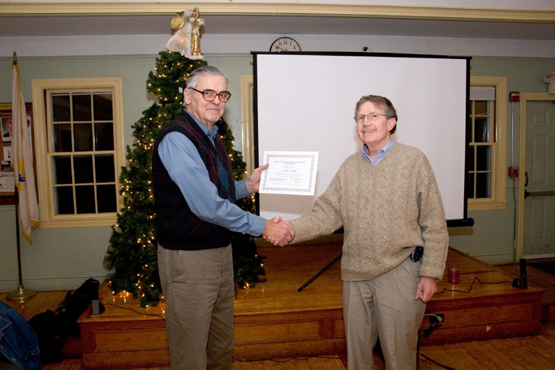 Dave Hurdis presents Gerry Dyck with a certificate commemmorating his 150,000th variable observation