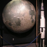 Moon globe and model Saturn V rocket