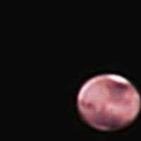 Mars, February 7, 2010. 10 inch Meade LX50 SCT working at f10 with a 2 power barlow inbetween the scope and camera. A color Mallincam was used. This was a 2 minute avi video processed thru Registax and some post processing courtesy of Tom Thibeault thru p