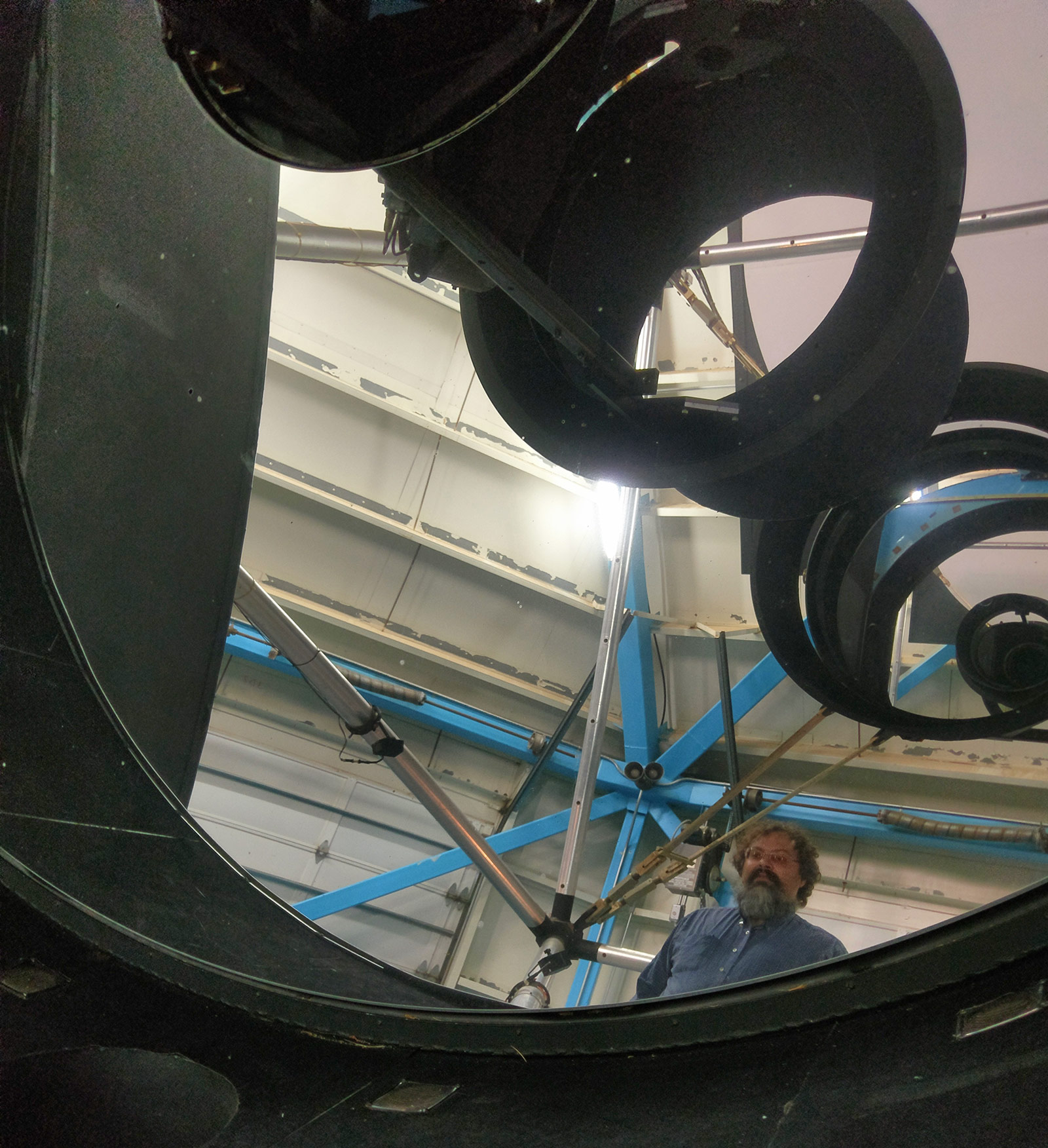 Ian Dell'Antonio reflected in the WIYN 3.5 meter primary mirror.